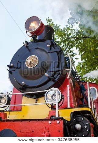 Old Soviet Steam Locomotive Blowing Off The Steam Out Of The Whistle