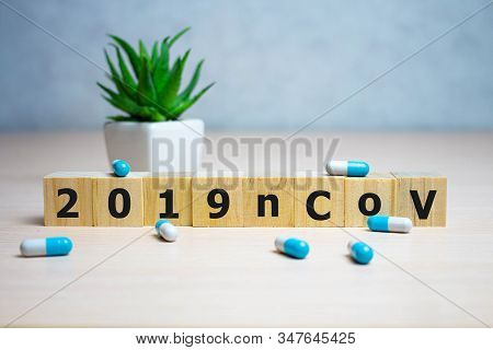 The Inscription 2019ncov On Wooden Cubes, Blue Background. Health Concept, Chinese 2019 Virus-ncov