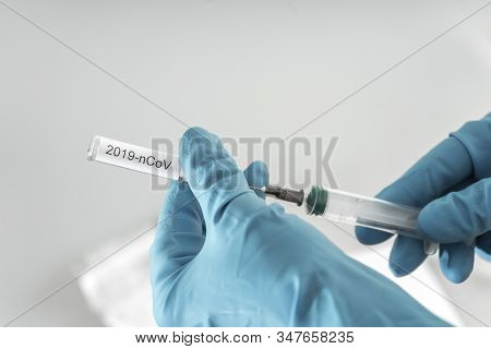 Doctor Puts Vaccine From 2019-ncov In Syringe