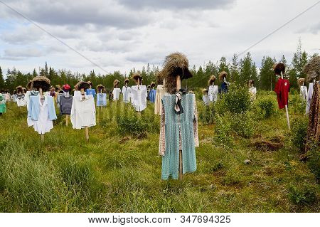 Suomussalmi, Finland - July 24, 2019: View To The Group Of Objects In People Clothes Which Looks Lik
