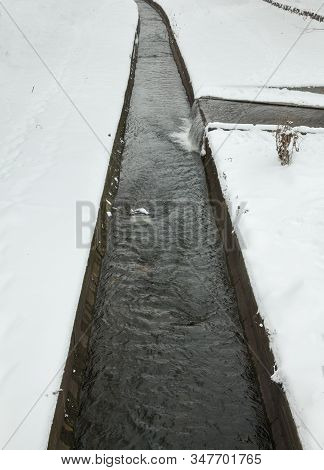 Urban Streams In Winter. The Lybid River (kyiv, Ukraine) In The Snow.