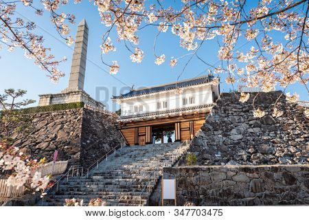 Kofu, Japan at Maizuzu Castle Park historic gateway and monument.