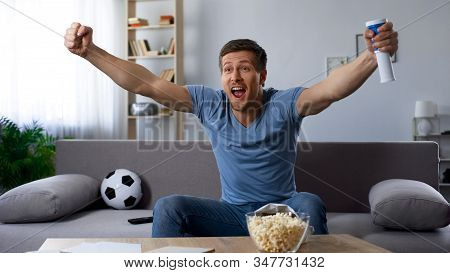 Happy Football Fan Loudly Congratulating Team On Winning Tournament, Match On Tv