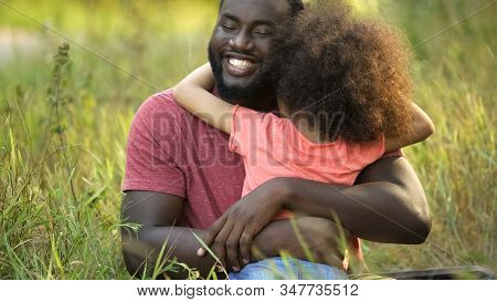 Happiest Father On Earth Embracing Cherished Daughter In Tight And Tender Hug