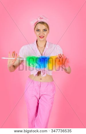 Cleaning Service. Cleaning Woman. Woman Hold Colorful Dusting Brush. Girl Cleaner With Feather Duste