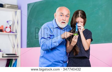 Science Lab. Small Girl Explore Fruit Slice. School. Microscopy. Analysis And Synthesis. Expand Know