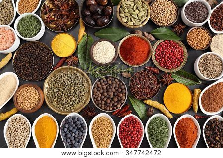 Aromatic Spices And Herbs In Metal And Ceramic Bowls. Top View.