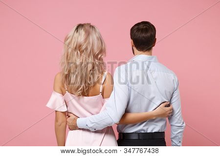 Back Rear View Of Couple Two Guy Girl In Party Outfit Celebrating Posing Isolated On Pastel Pink Bac