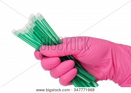 Dentist's Hand In Glove With A Saliva Ejectors.