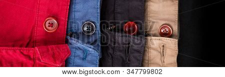 Banner Of Fagment Of Four Cotton Twill Pants Red, Blue, Black, Beige With Open Buttons.