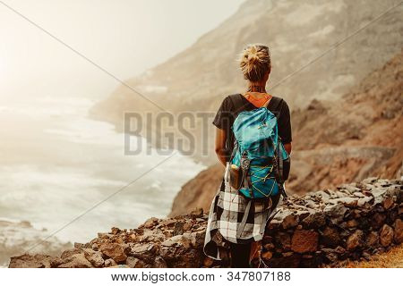 Santo Antao Island, Cape Verde. Tourist Female Enjoying View Of Rugged Coastline On Hiking Route Bet