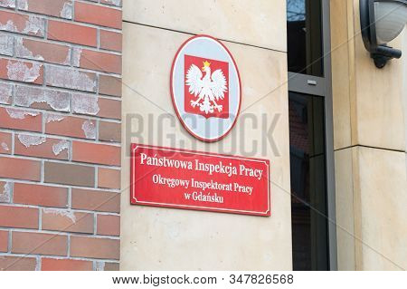 Gdansk, Poland - January 27, 2020: Polish Emblem And Information About National Labour Inspectorate 