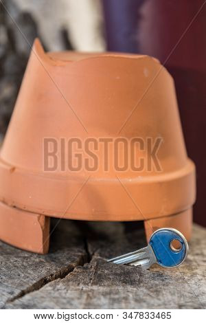 Key Hidden Under Flowerpot - Close-up Of Reserve Key