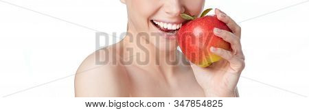 Portrait Of Happy Smiling Young Beautiful Woman Eating Red Apple, Over White Background