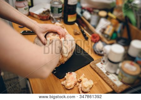 Woman Removing Fat From Fresh Capon Chapon Cockerel Meat On Kitchen Wooden Top French Organic Eco Bi