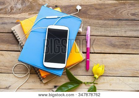 Notbook Monthly Planner With Mobile Phone For Business Work Of Lifestyle At Office Arrangement Flat 