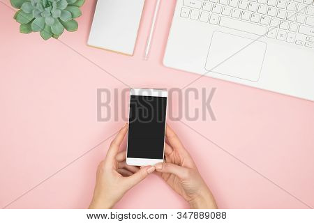 Womens Home Workspace. Girl Blogger Works With Phone And Laptop. Freelance Concept. Teleworker Texti