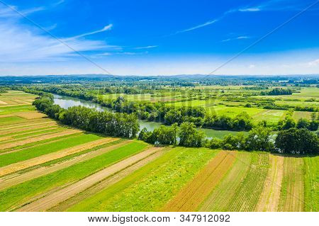 Beaufitul Landscape In Croatia, Kupa River Meandering Between Agriculture Fields In Lowlands, Shot F