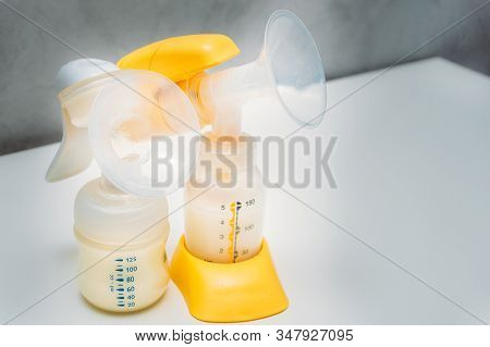 Manual And Electric Breast Pump Close-up. Breast Milk. Breast-feeding
