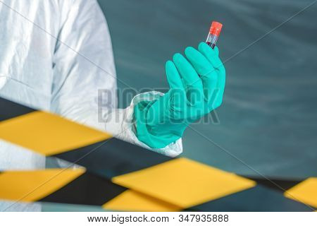 Epidemiologist With Blood Sample In Test Tube, Selective Focus