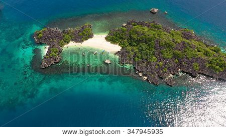 Tropical Island With Sandy With Tourists And Blue Sea, Aerial View. Lahos Island, Caramoan Islands, 