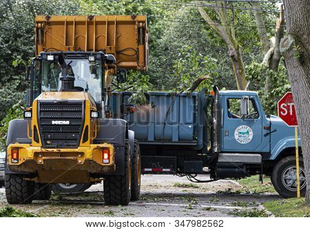 Babylon, New York, Usa - 23 August 2019: Babylon Village Trucks Clearing A Road Full Of Trees After 
