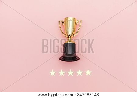 Simply Flat Lay Design Winner Or Champion Gold Trophy Cup And 5 Stars Rating Isolated On Pink Pastel