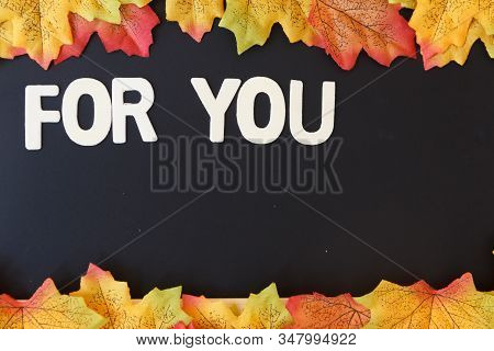 Love Day Concept. The Wooden Text Remain To Valentine's Day With Maple Leaf And Black Background.val