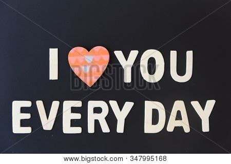 Love Day Concept. The Wooden Text Remain To Valentine's Day With Maple Leaf And Black Background.val
