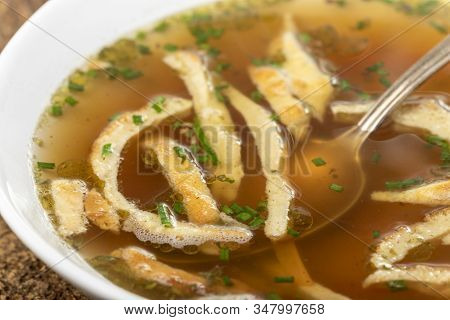 Overview Of A Bavarian Pancake Soup With A Spoon
