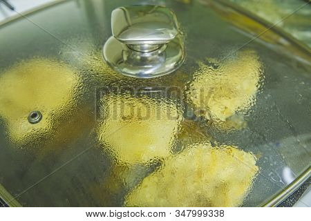 Cooking Chicken Meat On Grill Pan, Close Image Of Condens On The Glass Cover