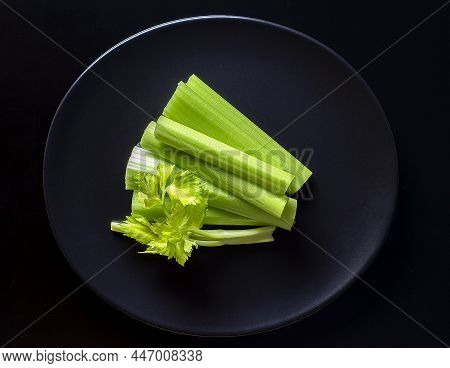 Fresh Celery On Blackplate On The Black Background