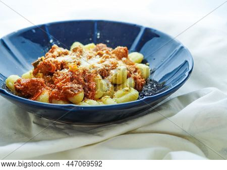 Plate Of Fresh Gnocchi With Tomato Sauce And Grated Parmesan Cheese