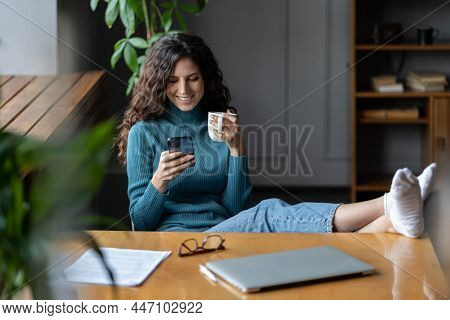 Young Remote Worker Girl Procrastinating At Workplace. Woman Sit At Desk With Closed Laptop Communic