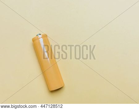 Rechargeable Nicd Aa Size Battery Isolated On Yellowish Background.