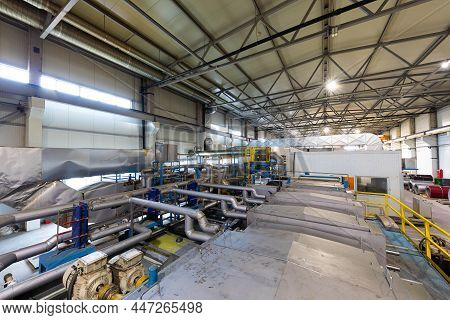 Production Line Of Metal Tile For Roof. Steel Forming Machine In Metalwork Factory Workshop