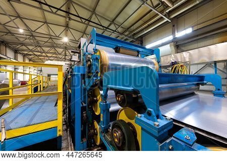 Photo Of Steel Roofing Forming Machine. Industrial Machine For Metal Sheet Roof Coils Cut. Process O