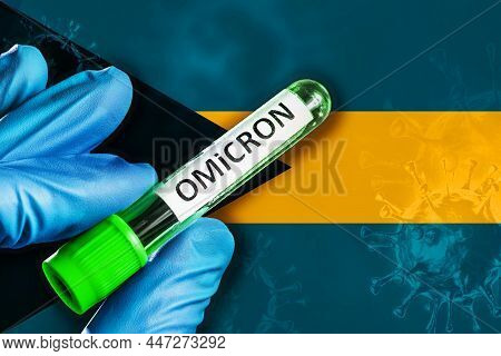 Bahamas Outbreak Of Omicron Variant. A Hand In A Blue Rubber Glove Holds A Test Tube With Covid-19 V