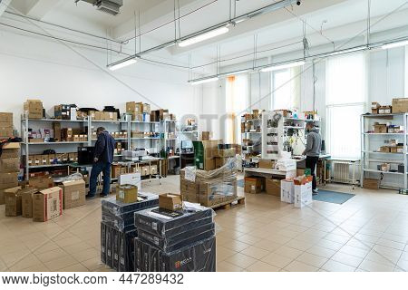 Minsk, Belarus - Jan 05, 2022: Photo Of A Warehouse With Boxes And Workers. Modern High-tech Plant F