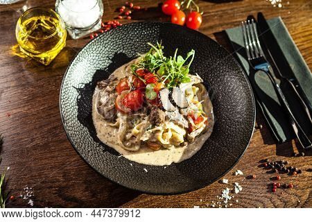 Black Angus Beef Tagliatelle Pasta With Fresh Black Truffles And Parmegano. Delicious Healthy Tradit