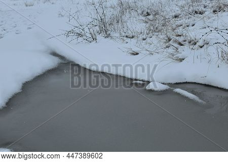 Streams Of Water, Melting Snow In Puddles And Around Trees In Early Spring