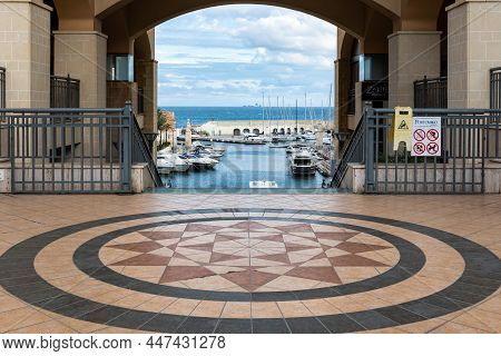 Saint Julian, Malta - 01 07 2022: Gate And Facade Of The Portomaso Building With The Harbor And Sea 