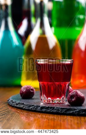 Homemade Infused Vodka, Tincture Or Liqueur Of Red Cherry. Berry Alcoholic Drinks Concept.