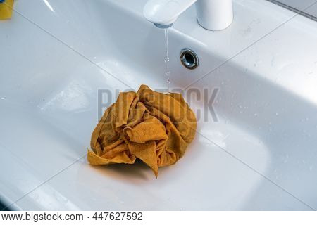 Dirty Cloth Abandoned Under Water In The Sink, Indoor Closeup Shot
