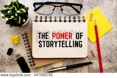 White Paper With Text The Power Of Storytelling On A Yellow Backgroundd With Stationery.