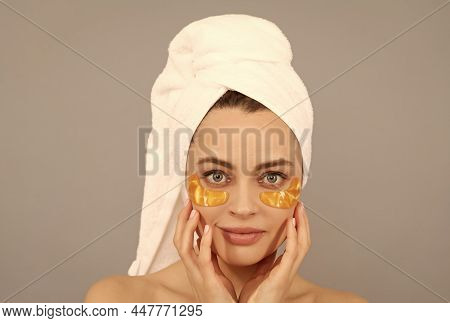 Applying Golden Anti-fatigue Mask. Girl Reduce Eye Bags. Skincare. Facial Collagen Cosmetic.