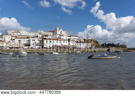 View Over The Mouth Of The Rio Arrade To The City Of Ferragudo. Ferragudo Is Located In The Algarve 