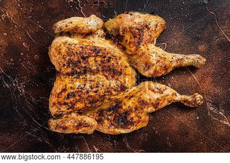 Whole Roasted Chicken Rotisserie With Herbs. Dark Background. Top View