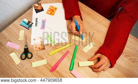 Woman Creating Feng Shui Wish Map Using Inscriptions And Overhead Photos. All Photos Are Taken By Th
