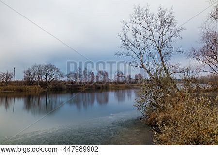 Long-exposure View Of The Tobol River And Bare Trees In Overcast Autumn Day, Kurgan, Russia